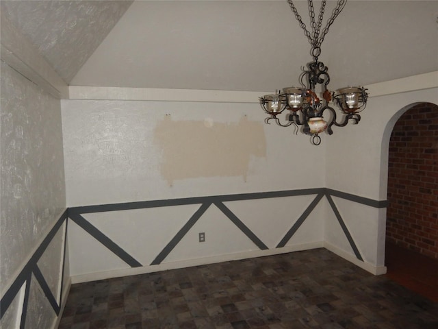 9217 Rhett Cir, Shreveport, LA 71118 - empty room with arched walkways, a chandelier, baseboards, and vaulted ceiling