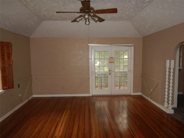 9217 Rhett Cir, Shreveport, LA 71118 - empty room featuring arched walkways, wood-type flooring, vaulted ceiling, french doors, and ceiling fan