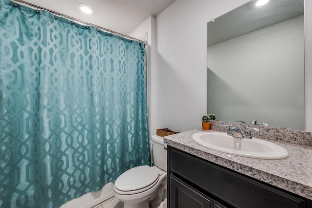 16421 Porterfield Ln, Justin, TX 76247 - bathroom featuring toilet, vanity, and recessed lighting
