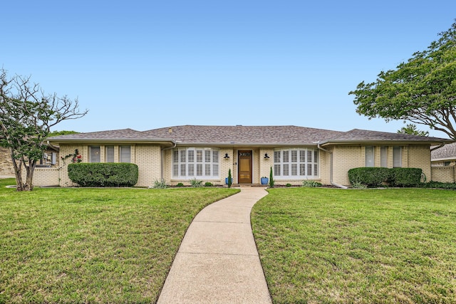 3309 Jomar Dr, Plano, TX 75075 - ranch-style home featuring brick siding and a front yard