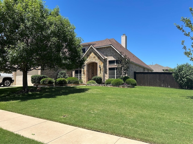 1102 Sunland Ct, Mansfield, TX 76063 - view of front of house with stone siding, a chimney, and brick siding