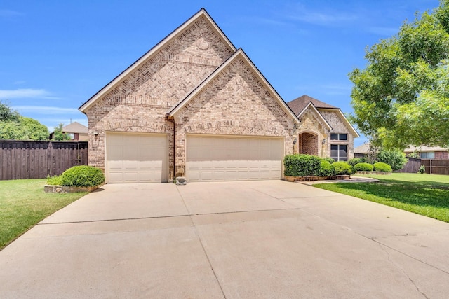 1102 Sunland Ct, Mansfield, TX 76063 - view of front of home featuring brick siding, concrete driveway, and an attached garage