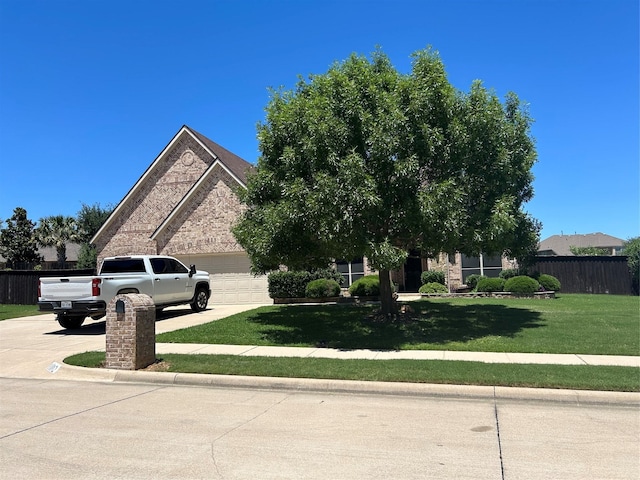 1102 Sunland Ct, Mansfield, TX 76063 - obstructed view of property with concrete driveway and a garage