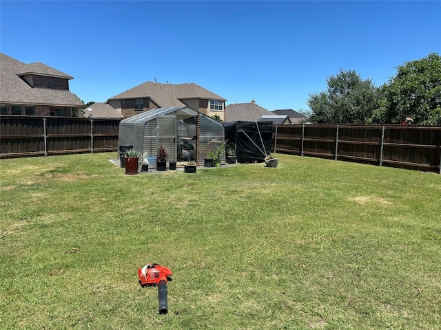 1102 Sunland Ct, Mansfield, TX 76063 - view of yard featuring a greenhouse and an outbuilding
