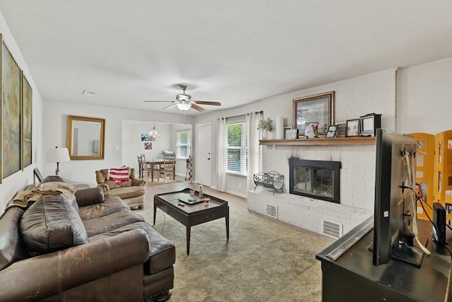 914 Glengarden St, Krum, TX 76249 - living room with a ceiling fan, carpet, and a brick fireplace