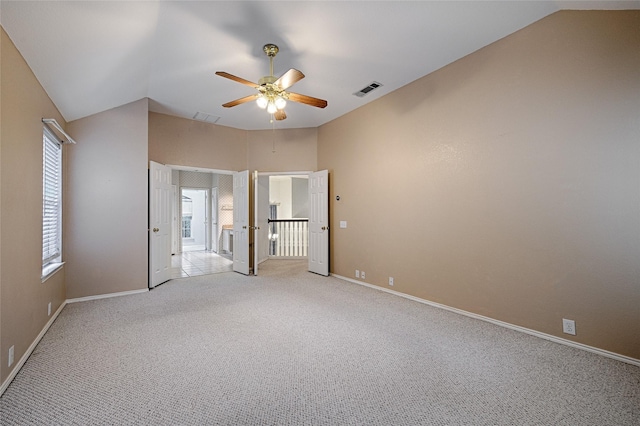 1503 Murphy Dr, Rockwall, TX 75087 - unfurnished bedroom featuring vaulted ceiling, light carpet, multiple windows, and baseboards