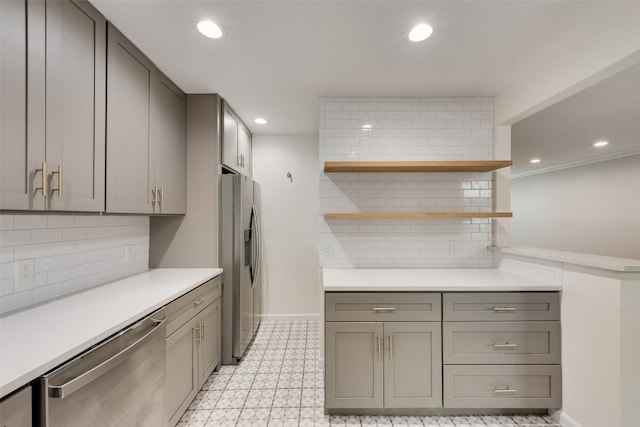 5010 Lahoma St, Dallas, TX 75235 - kitchen with stainless steel appliances, gray cabinetry, backsplash, light countertops, and recessed lighting