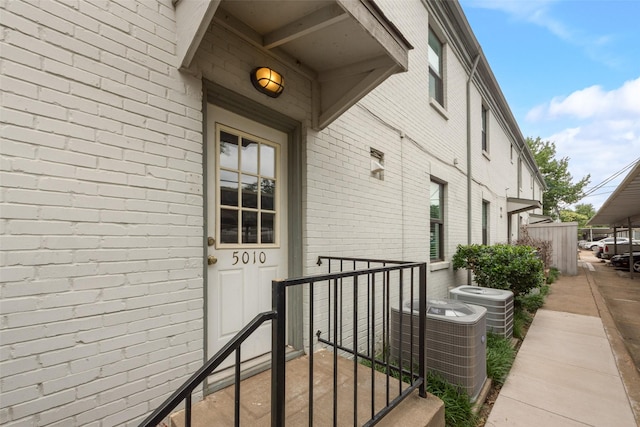 5010 Lahoma St, Dallas, TX 75235 - property entrance with central AC unit and brick siding