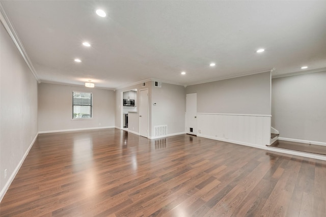 5010 Lahoma St, Dallas, TX 75235 - unfurnished living room with crown molding, recessed lighting, wood finished floors, baseboards, and stairs