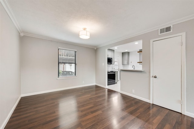 5010 Lahoma St, Dallas, TX 75235 - unfurnished living room featuring ornamental molding, dark wood-style floors, baseboards, recessed lighting, and a sink