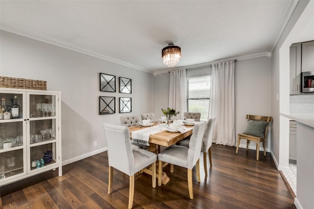 5010 Lahoma St, Dallas, TX 75235 - dining space with ornamental molding, dark wood-type flooring, baseboards, and a chandelier