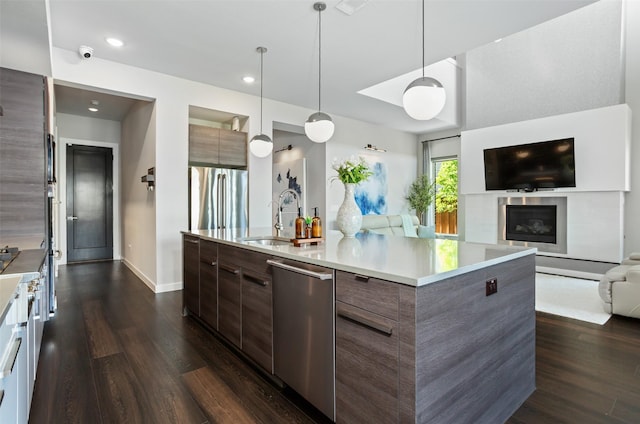 2468 Electra Dr, Allen, TX 75013 - kitchen featuring modern cabinets, stainless steel dishwasher, open floor plan, dark wood-style flooring, and light countertops