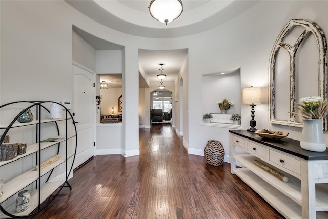 1003 Stanbridge Dr, Wylie, TX 75098 - hall with dark wood-style floors, arched walkways, and baseboards