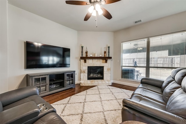 1003 Stanbridge Dr, Wylie, TX 75098 - living room with a ceiling fan, wood finished floors, a stone fireplace, and baseboards