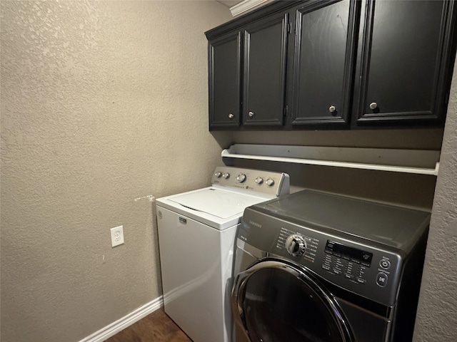 14051 Joe B Fulgham Cir, Brownsboro, TX 75756 - washroom with washing machine and dryer, cabinet space, a textured wall, and baseboards