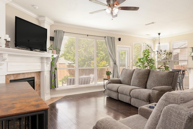 14221 Tijuana Trl, Fort Worth, TX 76052 - living room featuring a ceiling fan, a chandelier, plenty of natural light, wood finished floors, and ornamental molding