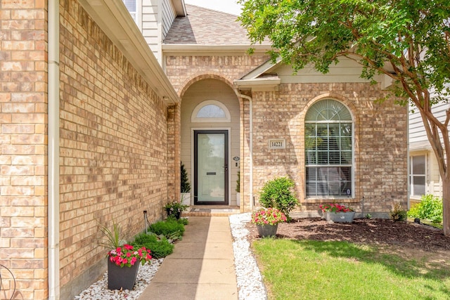 14221 Tijuana Trl, Fort Worth, TX 76052 - doorway to property featuring brick siding and roof with shingles