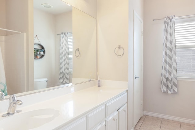 14221 Tijuana Trl, Fort Worth, TX 76052 - bathroom with tile patterned floors, toilet, vanity, and baseboards