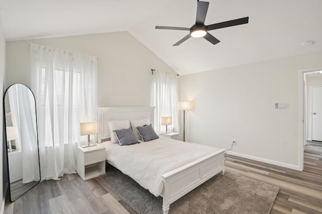 405 Rosemary Ln, Euless, TX 76039 - bedroom with light wood-type flooring, lofted ceiling, a ceiling fan, and baseboards