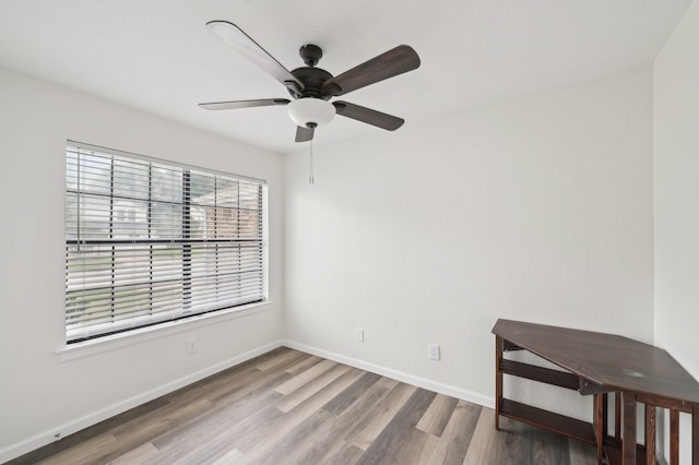 405 Rosemary Ln, Euless, TX 76039 - spare room with ceiling fan, wood finished floors, and baseboards