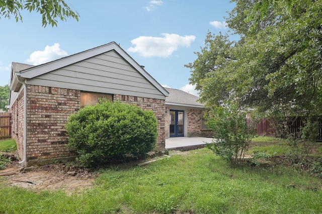 405 Rosemary Ln, Euless, TX 76039 - view of front facade with brick siding, a patio area, and french doors