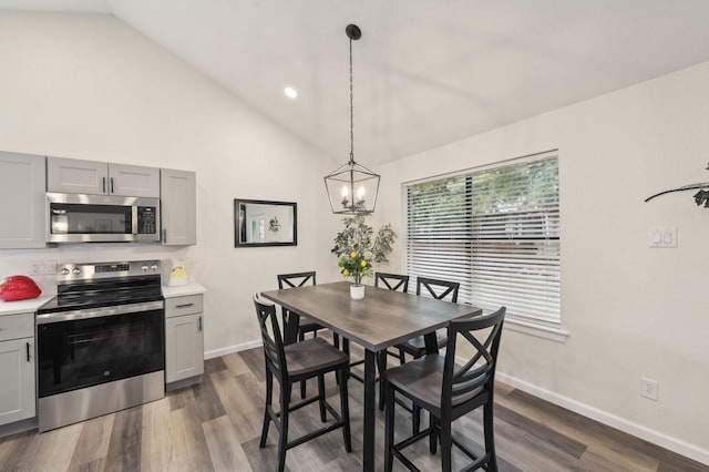 405 Rosemary Ln, Euless, TX 76039 - dining space featuring lofted ceiling, dark wood finished floors, a chandelier, baseboards, and recessed lighting
