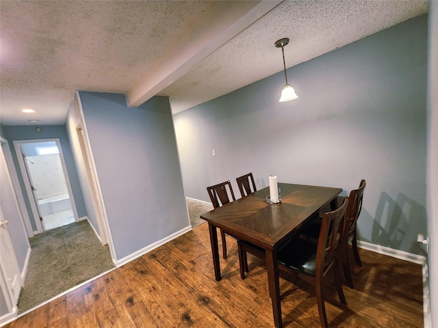 2908 Wilkinson Ave, Fort Worth, TX 76103 - dining space with a textured ceiling, baseboards, and wood finished floors