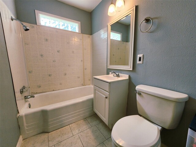 2908 Wilkinson Ave, Fort Worth, TX 76103 - full bathroom featuring toilet, washtub / shower combination, tile patterned flooring, and vanity