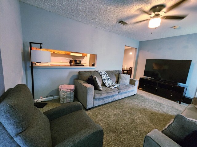 2908 Wilkinson Ave, Fort Worth, TX 76103 - living area featuring carpet, a ceiling fan, and a textured ceiling