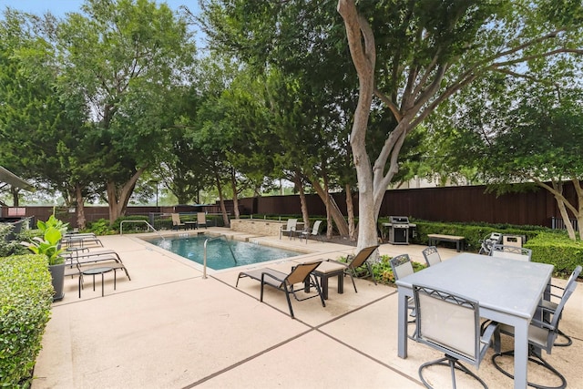 4605 Cedar Springs Rd Unit 339, Dallas, TX 75219 - view of swimming pool featuring a patio and a fenced backyard