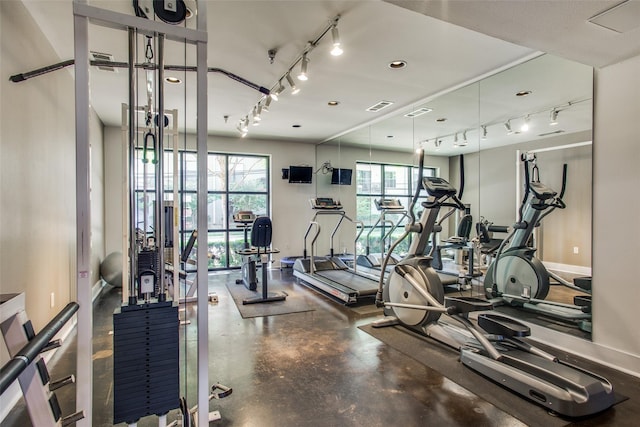 4605 Cedar Springs Rd Unit 339, Dallas, TX 75219 - gym with rail lighting and baseboards