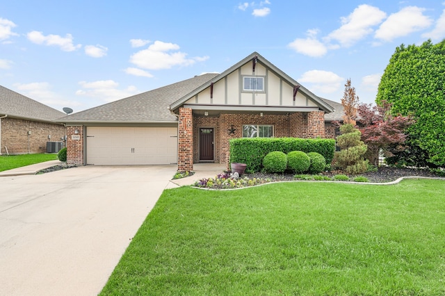6345 Pinionpark Way, Fort Worth, TX 76179 - tudor house featuring an attached garage, brick siding, concrete driveway, central AC, and a front yard
