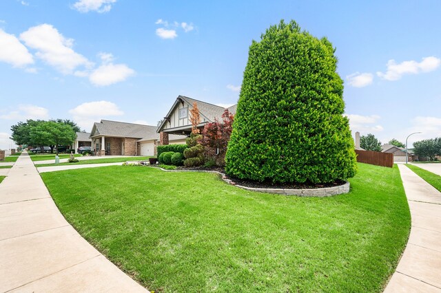 6345 Pinionpark Way, Fort Worth, TX 76179 - view of side of property featuring brick siding and a lawn