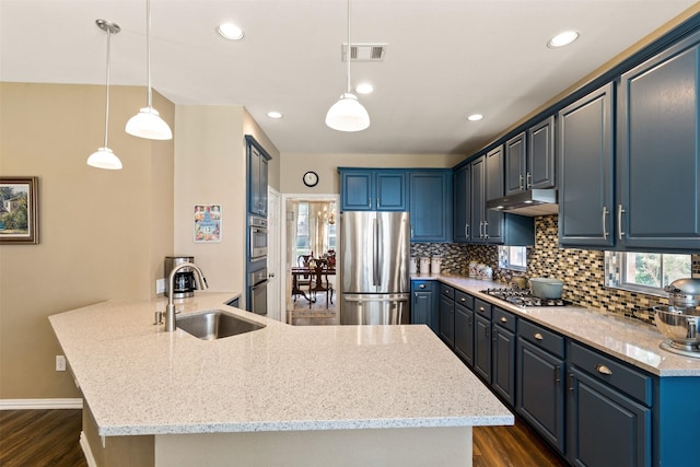 3625 Mackenzie Ln, Richardson, TX 75082 - kitchen with stainless steel appliances, a sink, a peninsula, dark wood-type flooring, and recessed lighting
