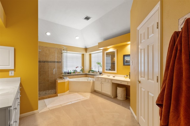 3625 Mackenzie Ln, Richardson, TX 75082 - bathroom featuring a stall shower, two vanities, a garden tub, vaulted ceiling, and recessed lighting