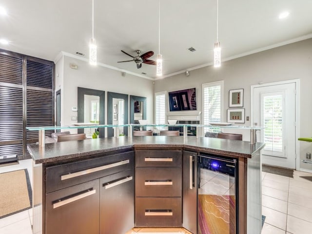 18004 Windflower Way, Dallas, TX 75252 - kitchen featuring wine cooler, ornamental molding, light tile patterned flooring, ceiling fan, and healthy amount of natural light