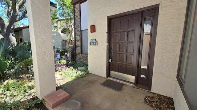 18040 Midway Rd Unit 123, Dallas, TX 75287 - doorway to property featuring stucco siding