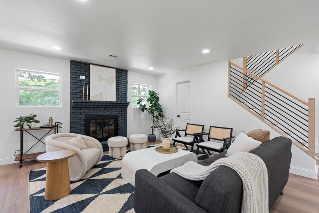 8317 Angier Way, Dallas, TX 75228 - living room featuring plenty of natural light, light wood finished floors, stairs, and recessed lighting