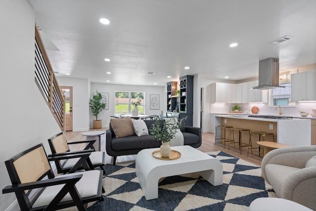 8317 Angier Way, Dallas, TX 75228 - living area with light wood-style flooring and recessed lighting