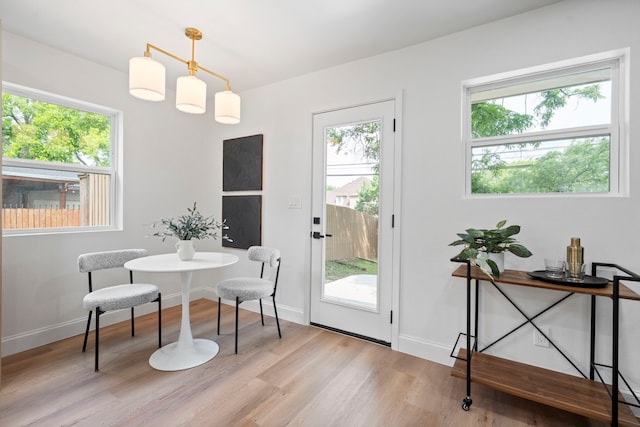 8317 Angier Way, Dallas, TX 75228 - dining space featuring plenty of natural light, light wood-style floors, and baseboards