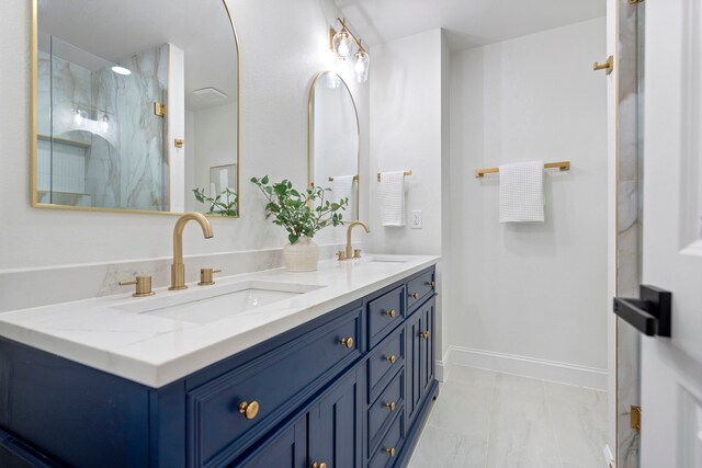 8317 Angier Way, Dallas, TX 75228 - bathroom with a marble finish shower, baseboards, double vanity, and marble look tile flooring