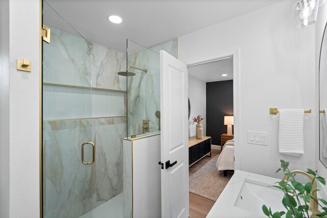 8317 Angier Way, Dallas, TX 75228 - ensuite bathroom with a marble finish shower, wood finished floors, and recessed lighting