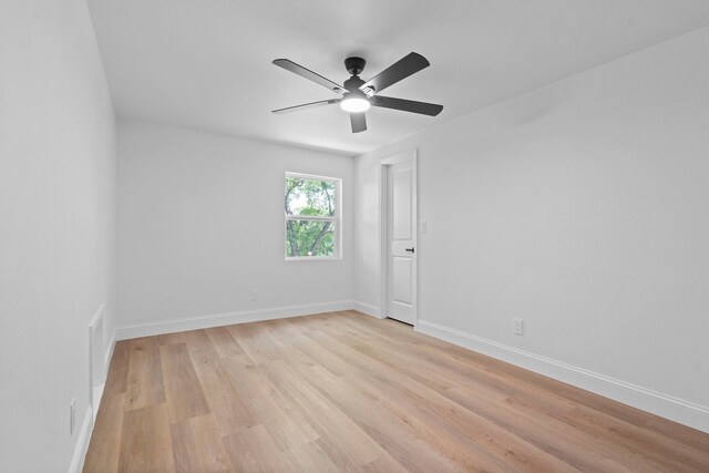 8317 Angier Way, Dallas, TX 75228 - spare room with light wood-style flooring, ceiling fan, and baseboards