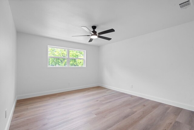 8317 Angier Way, Dallas, TX 75228 - unfurnished room featuring a ceiling fan, light wood finished floors, and baseboards