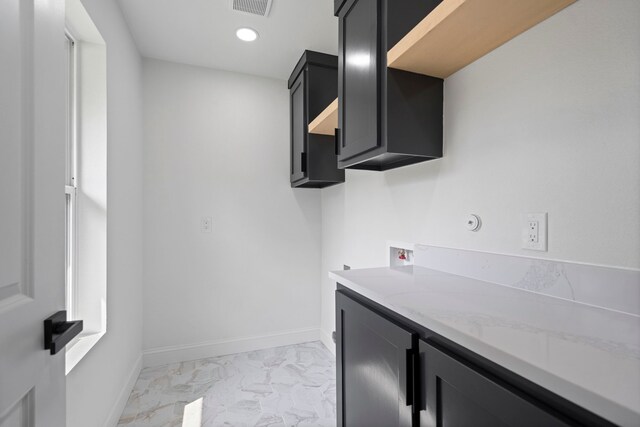 8317 Angier Way, Dallas, TX 75228 - washroom with cabinet space, light marble finish flooring, hookup for a washing machine, recessed lighting, and baseboards