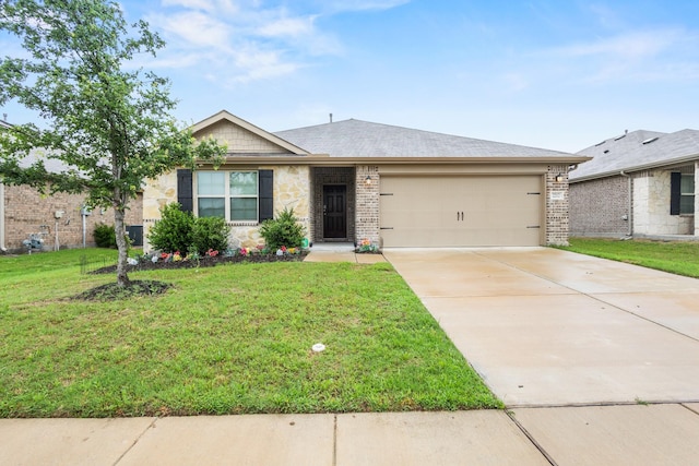 2212 Kingfisher St, Crandall, TX 75114 - single story home featuring an attached garage, concrete driveway, a front yard, brick siding, and stone siding