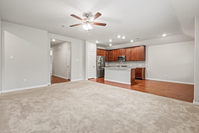 2212 Kingfisher St, Crandall, TX 75114 - kitchen with open floor plan, appliances with stainless steel finishes, carpet, a sink, and baseboards