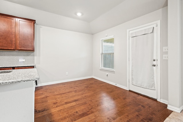 2212 Kingfisher St, Crandall, TX 75114 - kitchen with dark wood-type flooring, tasteful backsplash, baseboards, light stone countertops, and recessed lighting