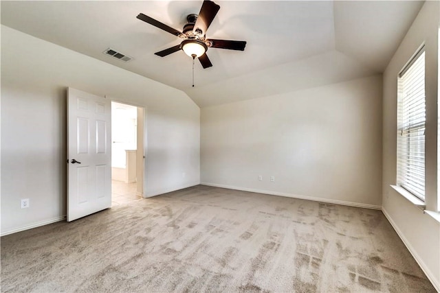 11711 Corsicana Dr, Frisco, TX 75035 - spare room featuring carpet flooring, ceiling fan, baseboards, and vaulted ceiling