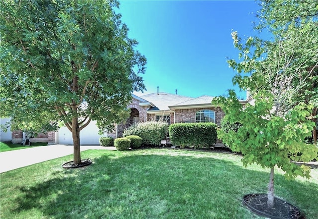 11711 Corsicana Dr, Frisco, TX 75035 - view of front of home featuring a front yard, a garage, driveway, and brick siding